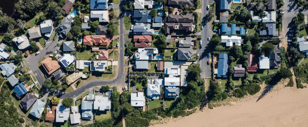 Aerial shot of suburbia and beach